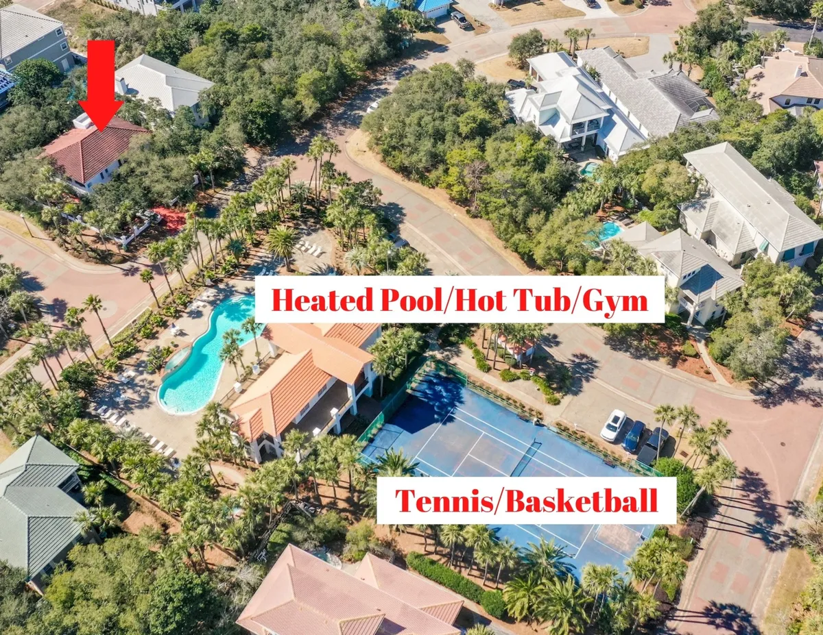 A sunlit exterior scene featuring a private heated pool with a soothing waterfall, a bubbling hot tub, a modern gym facility, and well-maintained tennis and basketball courts. Luxury homes with lush landscaping frame the background, creating an inviting, resort-like environment within the gated Destiny West community.